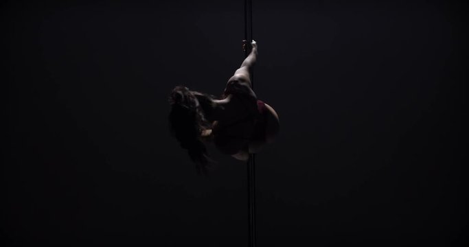 Girl doing pole dance, beautiful woman doing, female dancer, fitness and sport. Slow motion