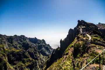 Fototapeta na wymiar Trekking at the highest mountain of Madeira, Pico Ruivo, Portugal. Madeira best island destination.