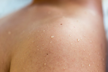 drops of water in the shoulder close-up
