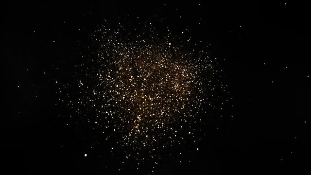 Super slow motion of glittering golden particles on black background, low dof. Filmed on high speed cinema camera, 1000fps.