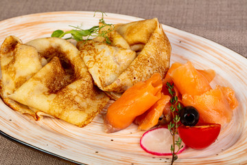 Russian pancakes with salmon