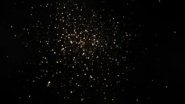 Super slow motion of glittering golden particles on black background, low dof. Filmed on high speed cinema camera, 1000fps.