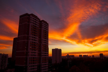 Fototapeta na wymiar The view from the window on the residential area of Moscow in the evening. Colorful beautiful sunset.