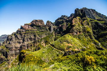 Colorful mountain ridge path with volcanic formations beside, Pico do Arieiro, Madeira, Portugal