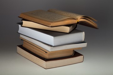 Open Book on Top of Books