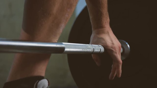 Close up of a gay who is taking a weihgts.