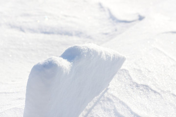 Background. Small clumps of white snow