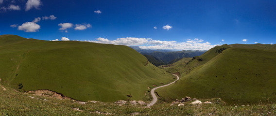 Panoramic view of the clouds above the hills near Mount Elbrus. Photographed in the Caucasus, Russia.