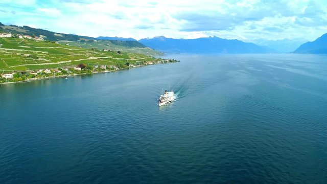 Aerial orbiting around CGN Belle-Epoque steam boat in front of Villette, Lake Leman - Lavaux, Switzerland