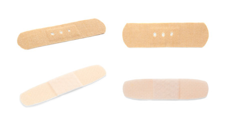 Set with adhesive plaster on white background. Medical objects