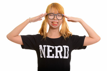 Young cute Asian nerd woman having headache