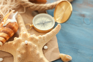 Starfish and sea shells on color table, closeup
