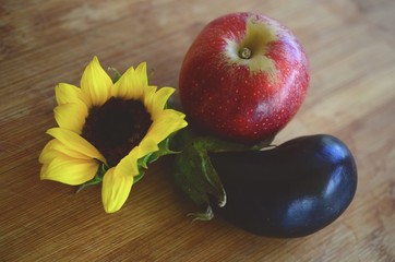 Fresh picked Apples, Eggplant, and Sunflower shot in Puerto Rico. Organic farming, fresh farmers market fall harvest. Delicious organic food. 
