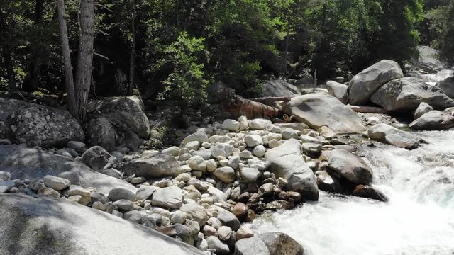 Low Drone Footage over a River in the Mountains of Corsica, France