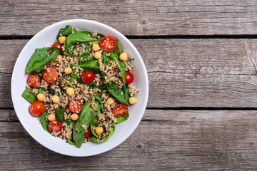 Spinach salad with quinoa , tomatoes and chickpea