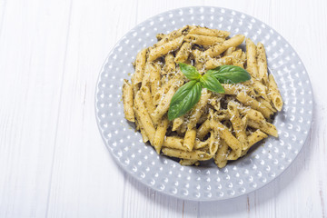 Italian penne pasta with sauce pesto