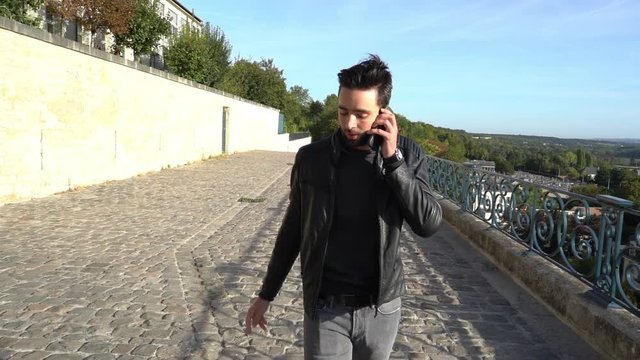 A man drop his phone when he saw a girl - slow motion