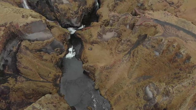 Cinematic aerial flyover of stunning Icelandic canyon.