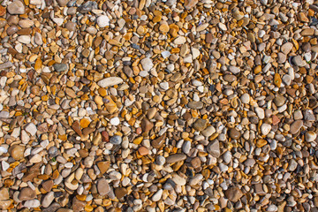 Rocks and Stone beach pattern closeup, Summer seacoast background