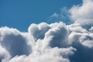 Naklejka na ściany i meble Blue sky with fluffy clouds