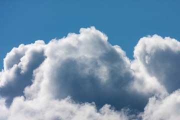 Blue sky with fluffy clouds
