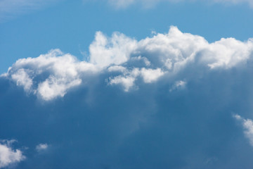 Blue sky with fluffy clouds