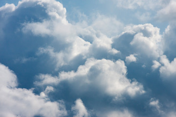 Blue sky with fluffy clouds