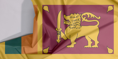 Sri Lanka fabric flag crepe and crease with white space, four color of green orange yellow and dark red with golden lion.