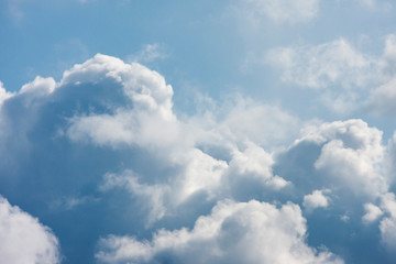 Blue sky with fluffy clouds