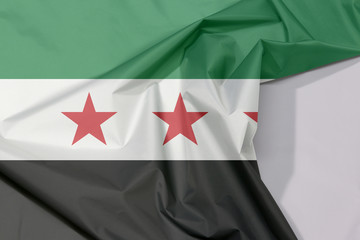 Syrian Interim Government fabric flag crepe and crease with white space, A horizontal tricolor of...