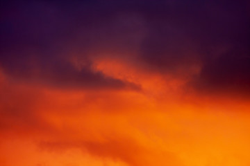 Fiery red and orange evening sky with a hint of blue and purple