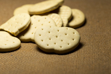 Baby biscuits on the surface of coarse brown fabrics