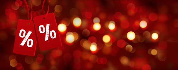 Bokeh Kulisse und Etiketten mit Prozent Zeichen - Rabatte zu Weihnachten, Cyber Monday