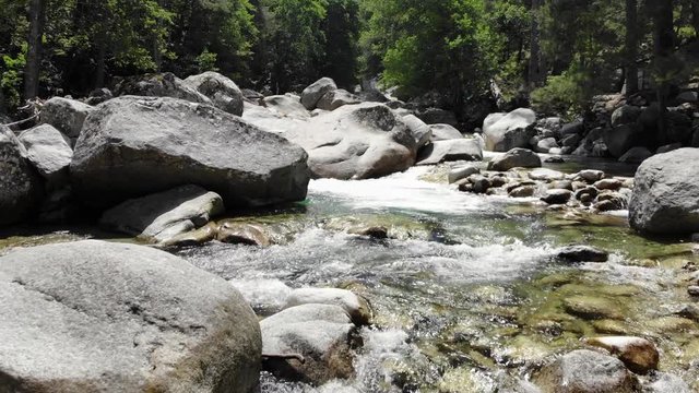 Low Drone Footage Flying down a River in the Mountains of Corsica, France