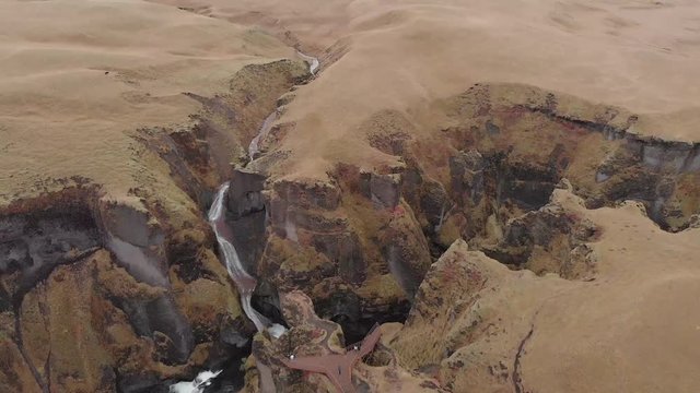 Cinematic aerial flyover of stunning Icelandic canyon.