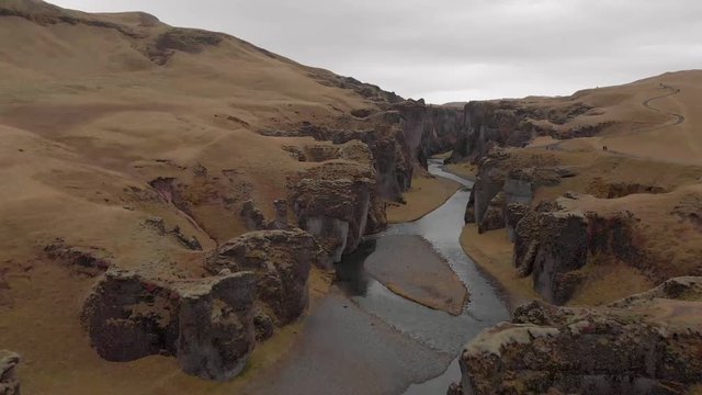 Cinematic aerial flyover of stunning Icelandic canyon.