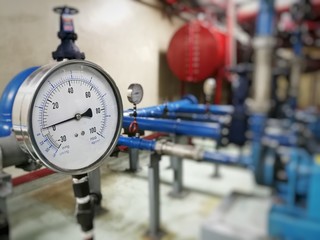 Pressure gauge in Pump room with blurred background