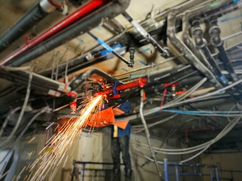 blurred image of Technician working on Site