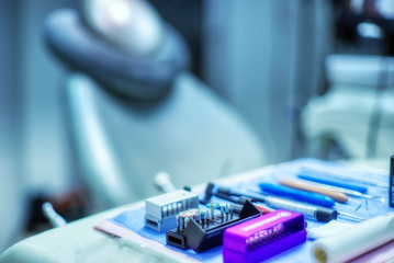 Selective focus of necessary dental equipment and working tool for dentist background chair and...