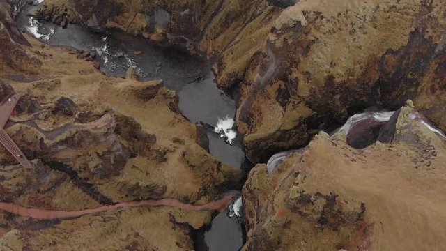 Cinematic aerial flyover of stunning Icelandic canyon.