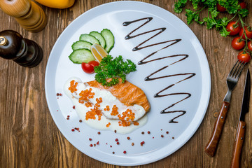 salmon in a creamy caviar sauce