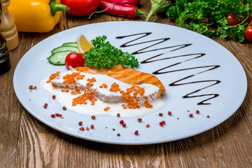 salmon in a creamy caviar sauce