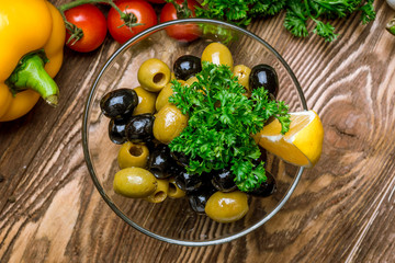 Kalamata olives on wooden table