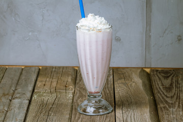 strawberry milkshake on wooden background