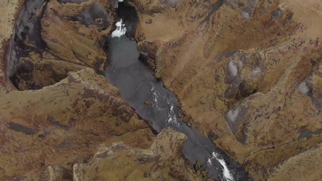 Cinematic aerial flyover of stunning Icelandic canyon.
