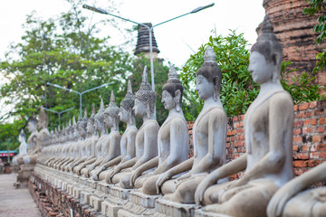 Buddha sit in a row in Thailand is a popular tourist destination.