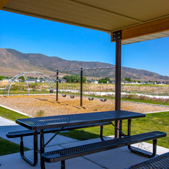 Fototapeta premium Eating area and playground in a in a sunny park