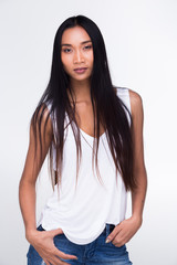 Fototapeta premium Asian Long straight black hair tan skin white vest