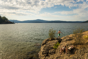 Fototapeta premium Three attractive young friends hangout at the beach.