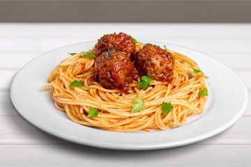 pasta with meatballs and parsley with tomato
